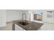 Bright kitchen with white cabinets, stainless steel appliances, and granite countertops at 653 W Freedom St, Florence, AZ 85132
