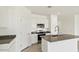 Bright kitchen with white cabinets, stainless steel appliances, and granite countertops at 653 W Freedom St, Florence, AZ 85132