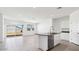 Bright kitchen with white cabinets, stainless steel appliances, and granite countertops at 653 W Freedom St, Florence, AZ 85132
