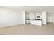 Open-concept living room and kitchen area with lots of natural light at 653 W Freedom St, Florence, AZ 85132
