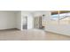 Bright living room area leading to a covered patio through sliding glass doors and windows at 653 W Freedom St, Florence, AZ 85132
