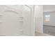 Bright white shower with built-in shelves, perfect for toiletries, and natural light at 653 W Freedom St, Florence, AZ 85132