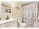 Clean bathroom featuring a vanity, toilet and shower with curtain at 7259 E Glencove St, Mesa, AZ 85207
