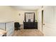 Comfortable bedroom with a closet, dresser and built in desk at 7259 E Glencove St, Mesa, AZ 85207