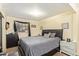 Bedroom with black furniture and grey carpet and accents at 7259 E Glencove St, Mesa, AZ 85207