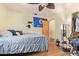 Comfortable bedroom featuring laminate flooring, closet, and natural light at 7259 E Glencove St, Mesa, AZ 85207