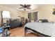 Comfortable bedroom featuring laminate flooring, closet, and natural light at 7259 E Glencove St, Mesa, AZ 85207