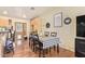 Comfortable dining area with wooden table, seating for six, and a charming 'Home' wall art at 7259 E Glencove St, Mesa, AZ 85207