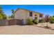 Charming two-story home with desert landscaping, featuring a gated driveway and a light stucco exterior at 7259 E Glencove St, Mesa, AZ 85207