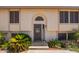 Charming front entrance with decorative door, desert landscaping, and a welcoming front porch at 7259 E Glencove St, Mesa, AZ 85207