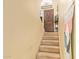 Carpeted stairs lead to a wooden front door with decorative touches and a wall mounted sign at 7259 E Glencove St, Mesa, AZ 85207