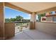 Relaxing balcony view of the community's landscaped grounds and blue skies at 8314 N 21St Dr # K208, Phoenix, AZ 85021