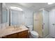 This bathroom features a glass-enclosed shower and a vanity with mirror and lighting at 8314 N 21St Dr # K208, Phoenix, AZ 85021