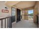 Inviting condo front entrance with a balcony, a secure screen door, and an exterior light at 8314 N 21St Dr # K208, Phoenix, AZ 85021