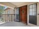 Inviting condo front entrance with a wooden door and secure screen door at 8314 N 21St Dr # K208, Phoenix, AZ 85021