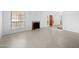 Bright living room with tile flooring, fireplace, and a large window at 8314 N 21St Dr # K208, Phoenix, AZ 85021