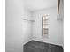 This walk-in closet offers plenty of storage space and a window to let in natural light at 8314 N 21St Dr # K208, Phoenix, AZ 85021