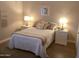 Comfortable bedroom with a well-lit bed flanked by nightstands and matching lamps at 1036 E Wagon Wheel Dr, Phoenix, AZ 85020