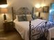 Cozy bedroom featuring an elegant iron bed frame and comfortable, decorative pillows at 1036 E Wagon Wheel Dr, Phoenix, AZ 85020