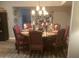 Elegant dining room featuring a round table with seating for eight, ideal for entertaining guests at 1036 E Wagon Wheel Dr, Phoenix, AZ 85020