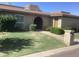 Charming single-story home featuring a brick facade, well-manicured lawn, and mature landscaping at 1036 E Wagon Wheel Dr, Phoenix, AZ 85020