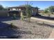 Community gravel garden with young trees and plants at 1036 E Wagon Wheel Dr, Phoenix, AZ 85020