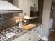 Functional kitchen with ample cabinet space, updated appliances, and stylish finishes at 1036 E Wagon Wheel Dr, Phoenix, AZ 85020