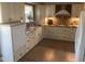 Modern kitchen with white cabinets, granite countertops, farmhouse sink, and stainless steel appliances at 1036 E Wagon Wheel Dr, Phoenix, AZ 85020