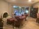 Inviting living room with hardwood floors, a cozy fireplace, and sliding glass doors opening to a garden patio at 1036 E Wagon Wheel Dr, Phoenix, AZ 85020
