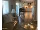 Cozy living room with hardwood floors that flows into a modern kitchen at 1036 E Wagon Wheel Dr, Phoenix, AZ 85020