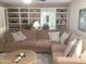 Comfortable living room with a large sectional sofa, built-in shelving, and ample natural light at 1036 E Wagon Wheel Dr, Phoenix, AZ 85020