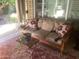 Comfortable seating area with a couch and lounge chairs on a covered patio at 1036 E Wagon Wheel Dr, Phoenix, AZ 85020
