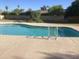 Sparkling community pool surrounded by lush landscaping and inviting lounge areas at 1036 E Wagon Wheel Dr, Phoenix, AZ 85020