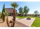 Artificial turf backyard with desert landscaping, a fire pit, and privacy fencing at 10830 W El Cortez Pl, Peoria, AZ 85383