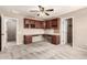 Bedroom features carpeted floors, a ceiling fan, and wooden workstation at 10830 W El Cortez Pl, Peoria, AZ 85383
