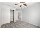 Bedroom features carpeted floors, ceiling fan, and closet at 10830 W El Cortez Pl, Peoria, AZ 85383