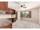 Bedroom features carpeted floors, a ceiling fan, and two windows with wooden shutters at 10830 W El Cortez Pl, Peoria, AZ 85383