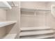 A closet features shelving, clothing rods, and carpeted floors at 10830 W El Cortez Pl, Peoria, AZ 85383