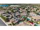Stunning aerial view capturing homes with pools, solar panels, and landscaped yards within a vibrant community at 10897 S Turtle Dove S Dr, Goodyear, AZ 85338