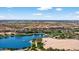 Picturesque lake community amenities include a community fountain, sandy beach, and a waterfront clubhouse at 10897 S Turtle Dove S Dr, Goodyear, AZ 85338