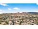 Scenic aerial view showcasing an upscale community nestled against a backdrop of striking mountain landscapes at 10897 S Turtle Dove S Dr, Goodyear, AZ 85338