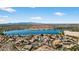 Picturesque community nestled by a serene lake surrounded by scenic mountain views at 10897 S Turtle Dove S Dr, Goodyear, AZ 85338
