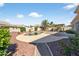 Backyard featuring a private pool, lush landscaping, a patio, and a grill at 10897 S Turtle Dove S Dr, Goodyear, AZ 85338