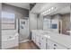 Bright bathroom featuring dual sinks, soaking tub, shower and neutral color palette at 10897 S Turtle Dove S Dr, Goodyear, AZ 85338