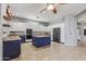 Spacious kitchen featuring granite countertops, stainless steel appliances and custom blue island at 10897 S Turtle Dove S Dr, Goodyear, AZ 85338