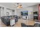 Cozy living room featuring tile floors, neutral colors, and a ceiling fan at 10897 S Turtle Dove S Dr, Goodyear, AZ 85338