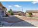 Private pool area features a brick patio and meticulously maintained desert landscaping at 10897 S Turtle Dove S Dr, Goodyear, AZ 85338