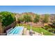 A landscaped backyard with a hot tub, turf, desert landscaping and views of a hill at 11025 N 10Th St, Phoenix, AZ 85020