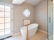 Serene bathroom featuring a modern soaking tub, and walk-in glass shower at 11025 N 10Th St, Phoenix, AZ 85020