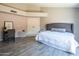 Modern primary bedroom features neutral walls, wood floors and large closet behind closed double doors at 11025 N 10Th St, Phoenix, AZ 85020